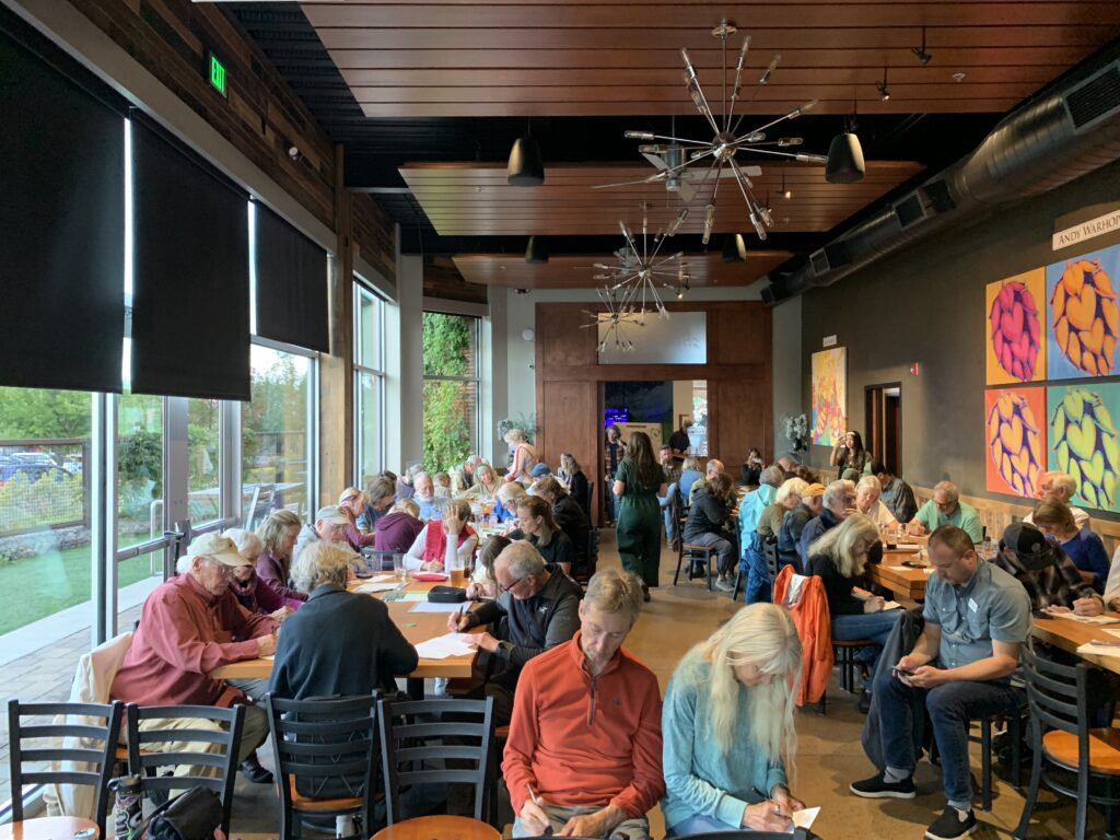 Public lands advocates in Bend, Oregon show up to write and submit public comments on the proposed Roadless rule rescission.